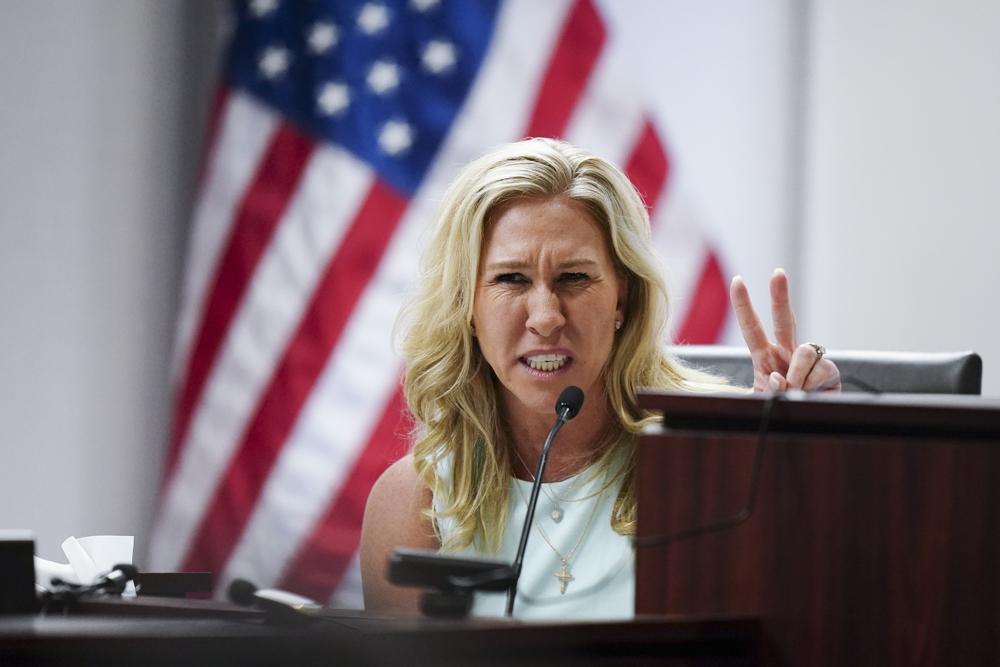 U.S. Rep. Marjorie Taylor Greene speaks during a hearing, Friday, April 22, 2022, in Atlanta. Greene is appearing at a hearing Friday in Atlanta in a challenge filed by voters who say she shouldn't be allowed to seek reelection because she helped facilitate the attack on the Capitol that disrupted certification of Joe Biden's presidential victory.(AP Photo/John Bazemore, Pool)