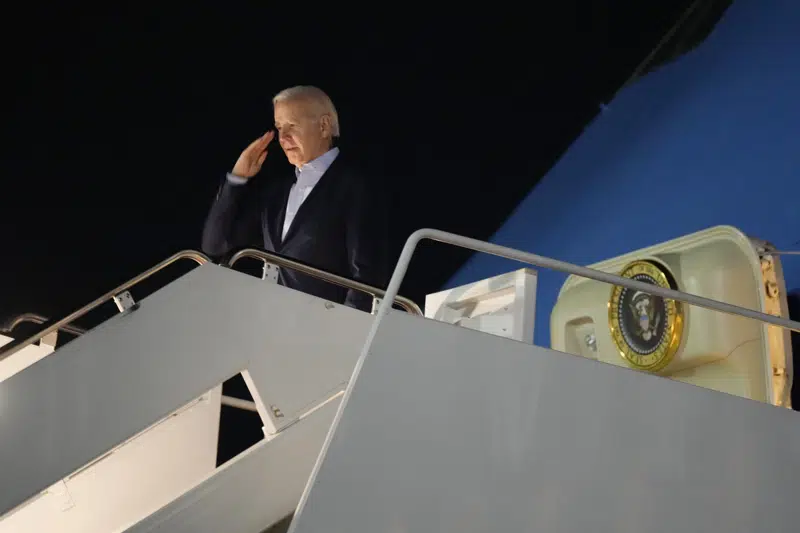 President Joe Biden salutes as he boards Air Force One at Andrews Air Force Base, Md., on Tuesday, Dec. 27, 2022. Biden and his family are traveling to St. Croix, U.S. Virgin Islands, to celebrate New Year. (AP Photo/Manuel Balce Ceneta)