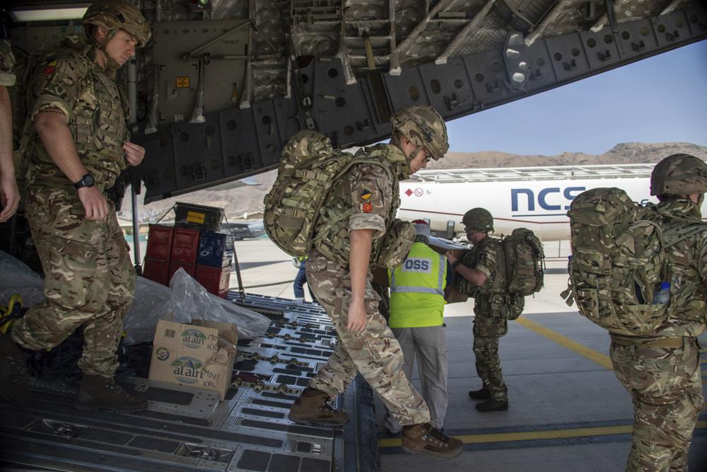 In this photo provided by the Ministry of Defence on Sunday, Aug. 15, 2021, members of the 16 Air Assault Brigade arrive in Kabul as part of a 600-strong UK-force sent to assist with Operation PITTING to rescue British nationals in Afghanistan amidst the worsening security situation there. (Leading Hand Ben Shread/Ministry of Defence via AP)