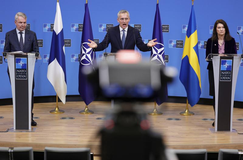 FILE - NATO Secretary General Jens Stoltenberg, center, participates in a media conference with Finland's Foreign Minister Pekka Haavisto, left, and Sweden's Foreign Minister Ann Linde, right, at NATO headquarters in Brussels, Jan. 24, 2022. The question of whether to join NATO is coming to a head in Finland and Sweden, where Russia's invasion of Ukraine has shattered the long-held belief that remaining outside the military alliance was the best way to avoid trouble with their giant neighbor. (AP Photo/Olivier Matthys, File)
