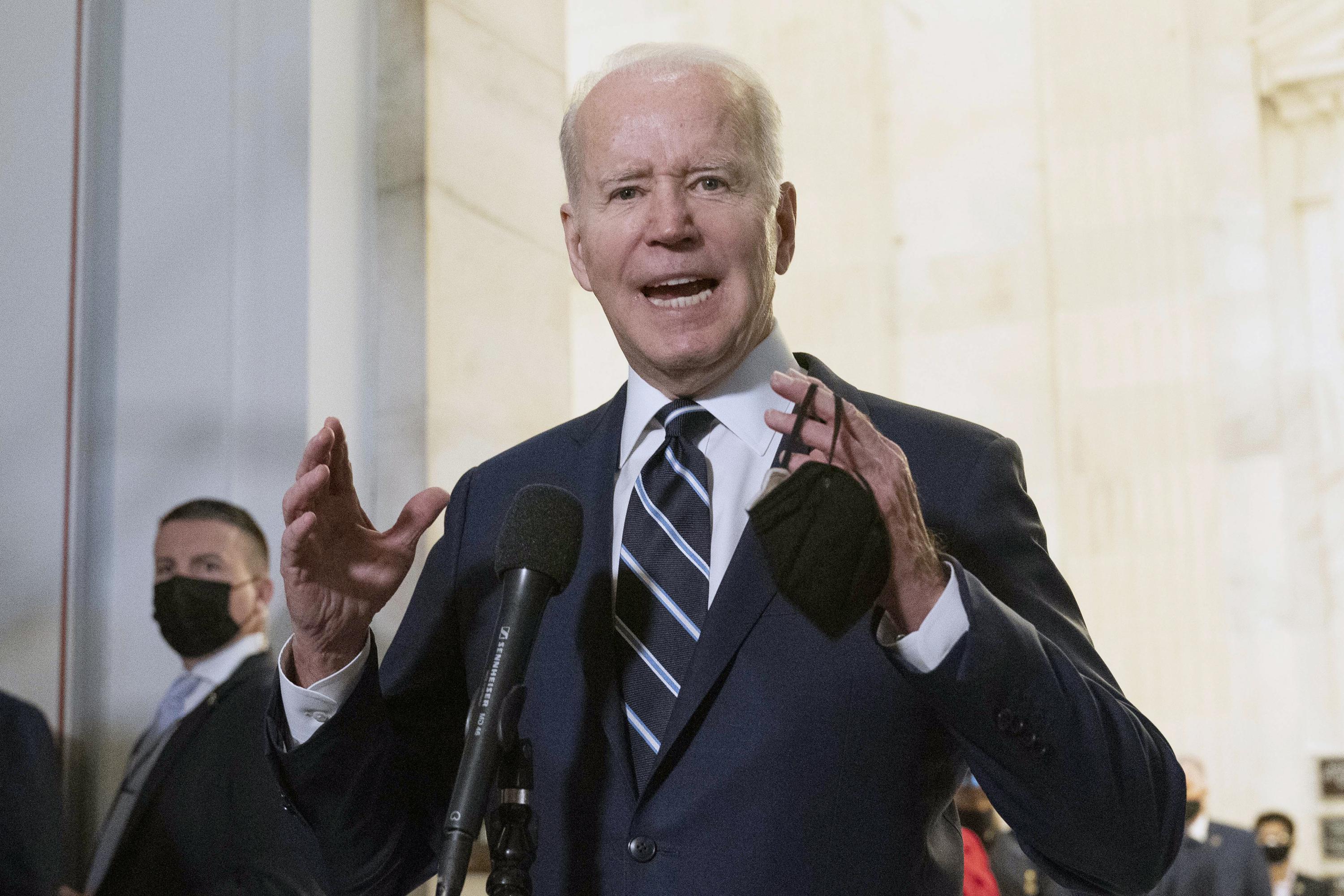 Biden says nation weary from COVID, but US in a better place