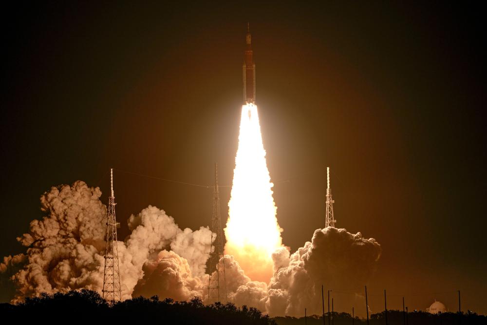 NASA's new moon rocket lifts off from Launch Pad 39B at the Kennedy Space Center in Cape Canaveral, Fla., Wednesday, Nov. 16, 2022. This launch is the first flight test of the Artemis program. (AP Photo/John Raoux)