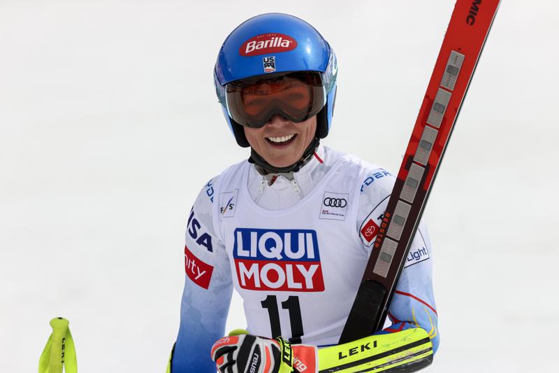 United States' Mikaela Shiffrin smiles after crossing the finish line of an alpine ski, women's World Cup Finals super-G, in Courchevel, France, Thursday, March 17, 2022. (AP Photo/Alessandro Trovati)