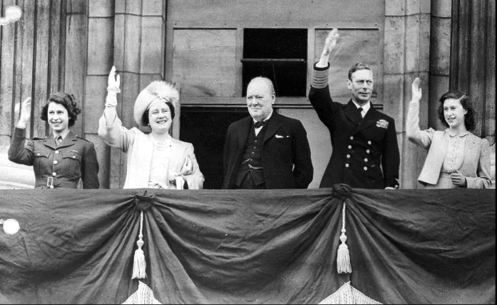 FILE - In this May 8, 1945 file photo Britain's Prime Minister Winston Churchill, center, joins the Royal family, from left, Princess Elizabeth, Queen Elizabeth, King George VI, and Princess Margaret, on the balcony of Buckingham Palace, London, England, on VE-Day. Queen Elizabeth II, Britain’s longest-reigning monarch and a symbol of stability across much of a turbulent century, has died on Thursday, Sept, 8, 2022. She was 96. (AP Photo)