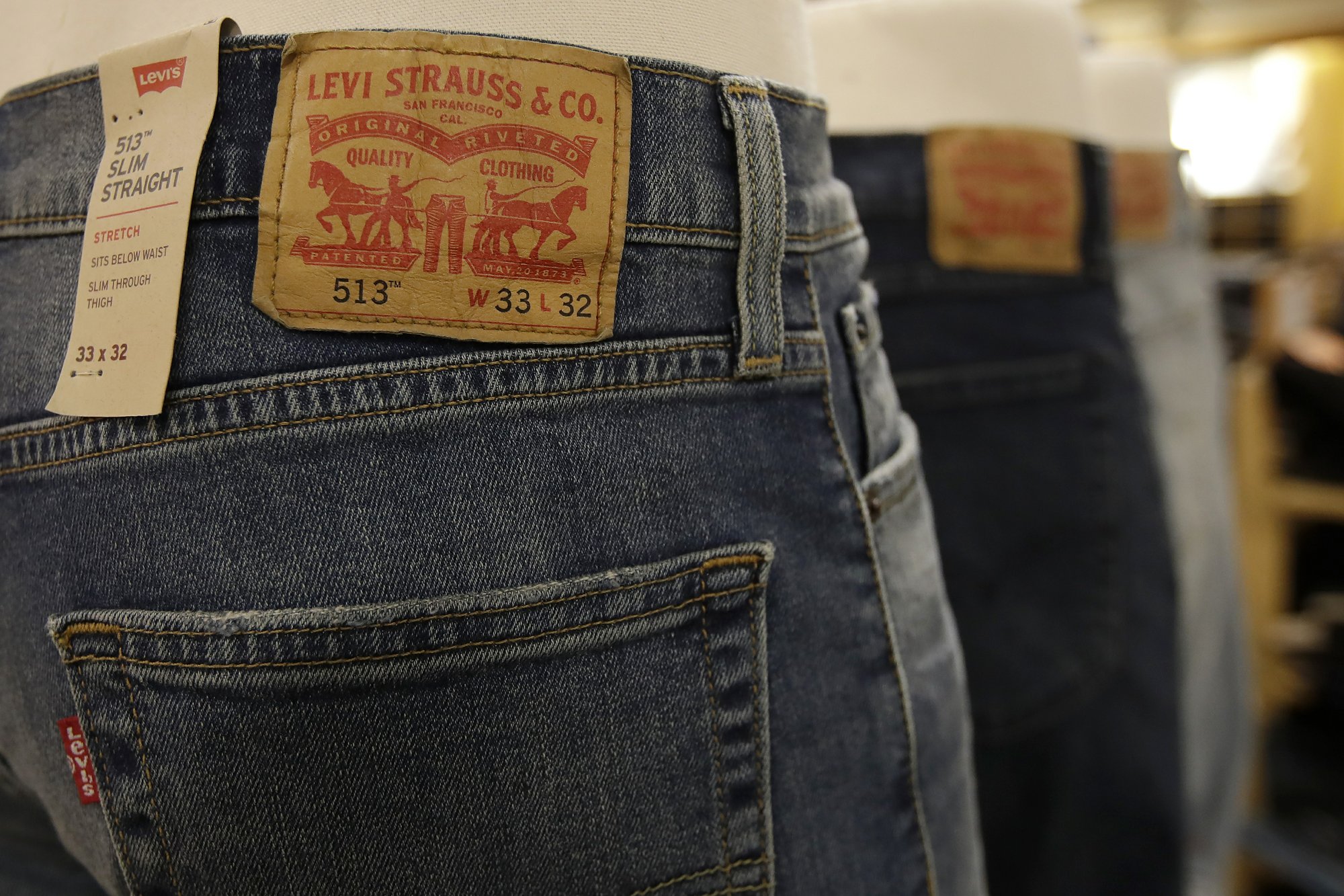 Levi's to cut 700 office jobs due to virus-related slump | AP News