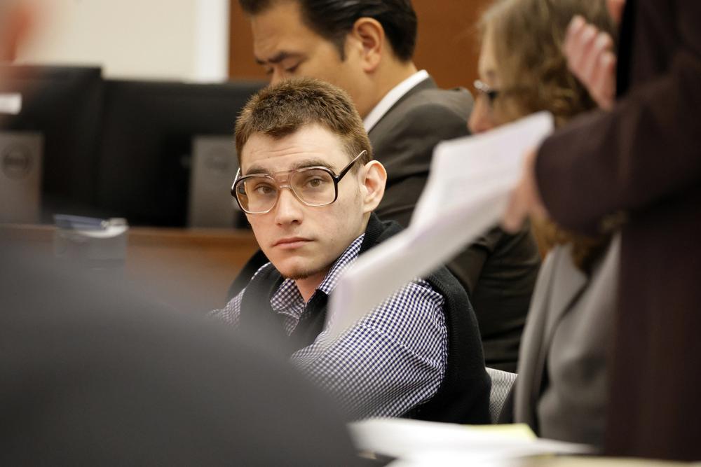 Marjory Stoneman Douglas High School shooter Nikolas Cruz sits at the defense table during the penalty phase of his trial, Wednesday, July 6, 2022, at the Broward County Courthouse in Fort Lauderdale, Fla. (Carline Jean/South Florida Sun-Sentinel via AP)