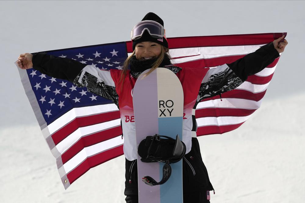 FILE - United States' Chloe Kim celebrates during the venue ceremony for the women's halfpipe at the 2022 Winter Olympics, Thursday, Feb. 10, 2022, in Zhangjiakou, China. (AP Photo/Francisco Seco, File)