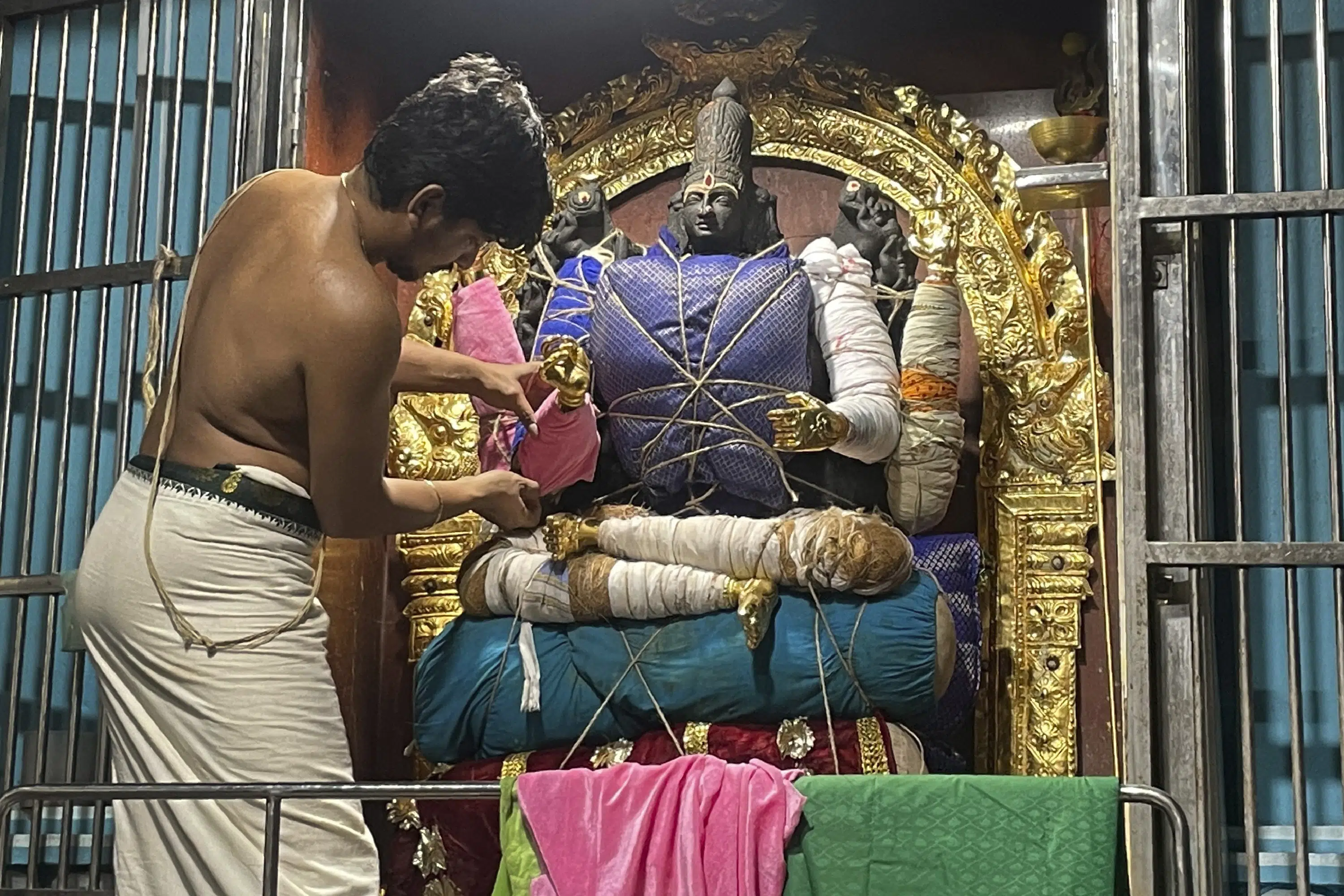 In India, deity decorating a hindu temple artist vocation