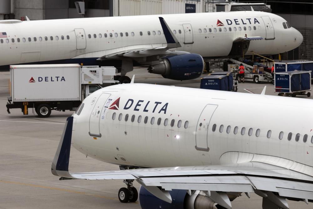Delta Air Lines plane leaves the gate, Monday, July 12, 2021, at Logan International Airport in Boston.  Delta Air Lines has requested that the U.S. Department of Justice put any person convicted of a disruption on board a flight to the national “no fly” list. In a letter to the Justice Department Attorney General Merrick Garland dated Thursday, Feb. 3, 2022, Delta CEO Ed Bastian said there should be “zero tolerance” for any behavior that affects flight safety.  (AP Photo/Michael Dwyer)