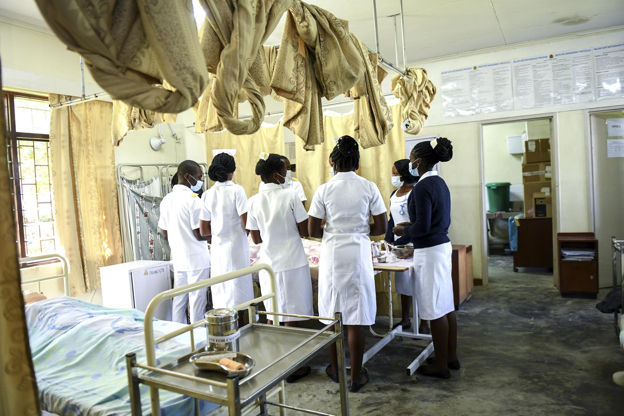 Nursing and Midwifery students stand in a Skills Laboratory, at St Joseph College of Nursing and Midwifery in Chiradzulu southern Malawi on Friday, May 28, 2021. Health officials in Malawi say fewer women are getting prenatal care amid the COVID-19 pandemic. At risk are the developing country's gains on its poor rate of maternal deaths. (AP Photo/Thoko Chikondi)