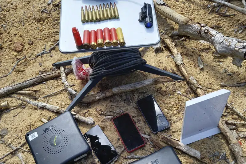 In this image provided by IBAMA, Brazil's Environmental Agency, Elon Musk's Starlink, providing a high-speed connection in Brazil's Amazon remote places, is visible, bottom right, in the Yanomami Indigenous territory, Roraima state, Brazil, Tuesday, March 14, 2023. Federal agents seized the internet kit in an illegal mining pit. (IBAMA via AP)