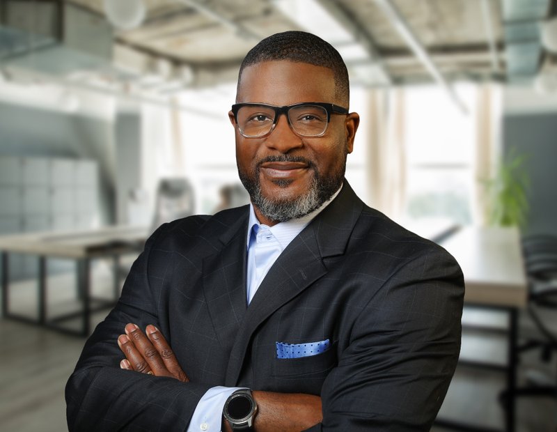 In this undated photo provided by McDonald's, Reginald Miller poses for a portrait. McDonald’s has hired Miller as the company’s new global chief diversity equity and inclusion officer as it struggles with charges of harassment and racism at all levels of the company. (Jeff Perry/Rocky Mountain Photography/McDonald's via AP)