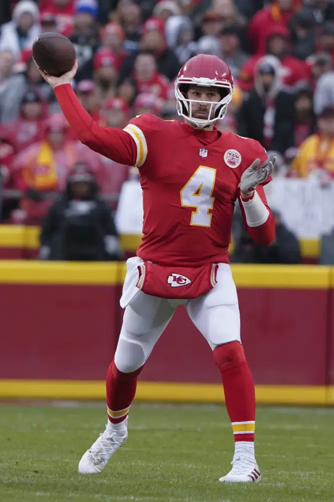 Kansas City Chiefs quarterback Chad Henne (4) passes against the Jacksonville Jaguars during the first half of an NFL divisional round playoff football game, Saturday, Jan. 21, 2023, in Kansas City, Mo. (AP Photo/Ed Zurga)