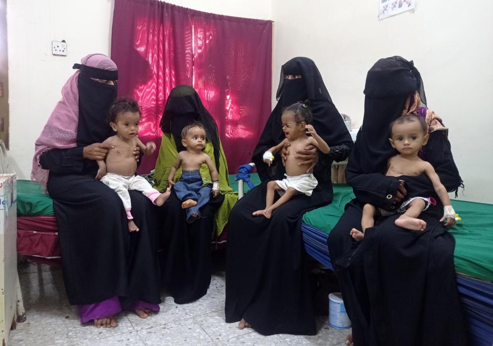 Women hold their malnourished children at the Hays Rural Hospital in Hodeida, Yemen, Oct. 11, 2022. For years starvation has been an everyday threat for Yemen’s children. Now, as the war threatens to escalate between the country’s warring parties after months of a tenuous truce, there are fears that it could get worse. (AP Photo/Hussam Al-Bakry)