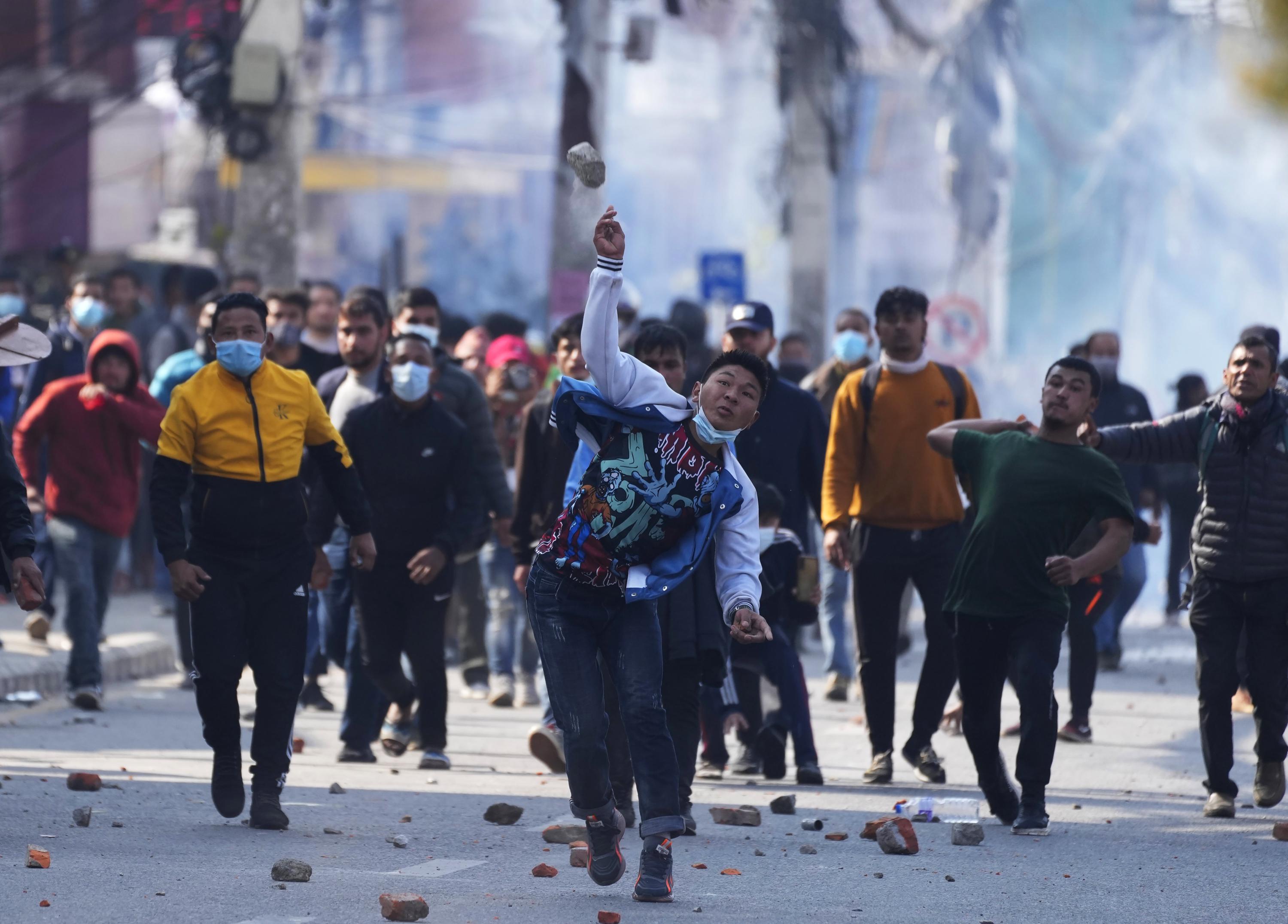 Protesters against US grant clash with riot police in Nepal AP News