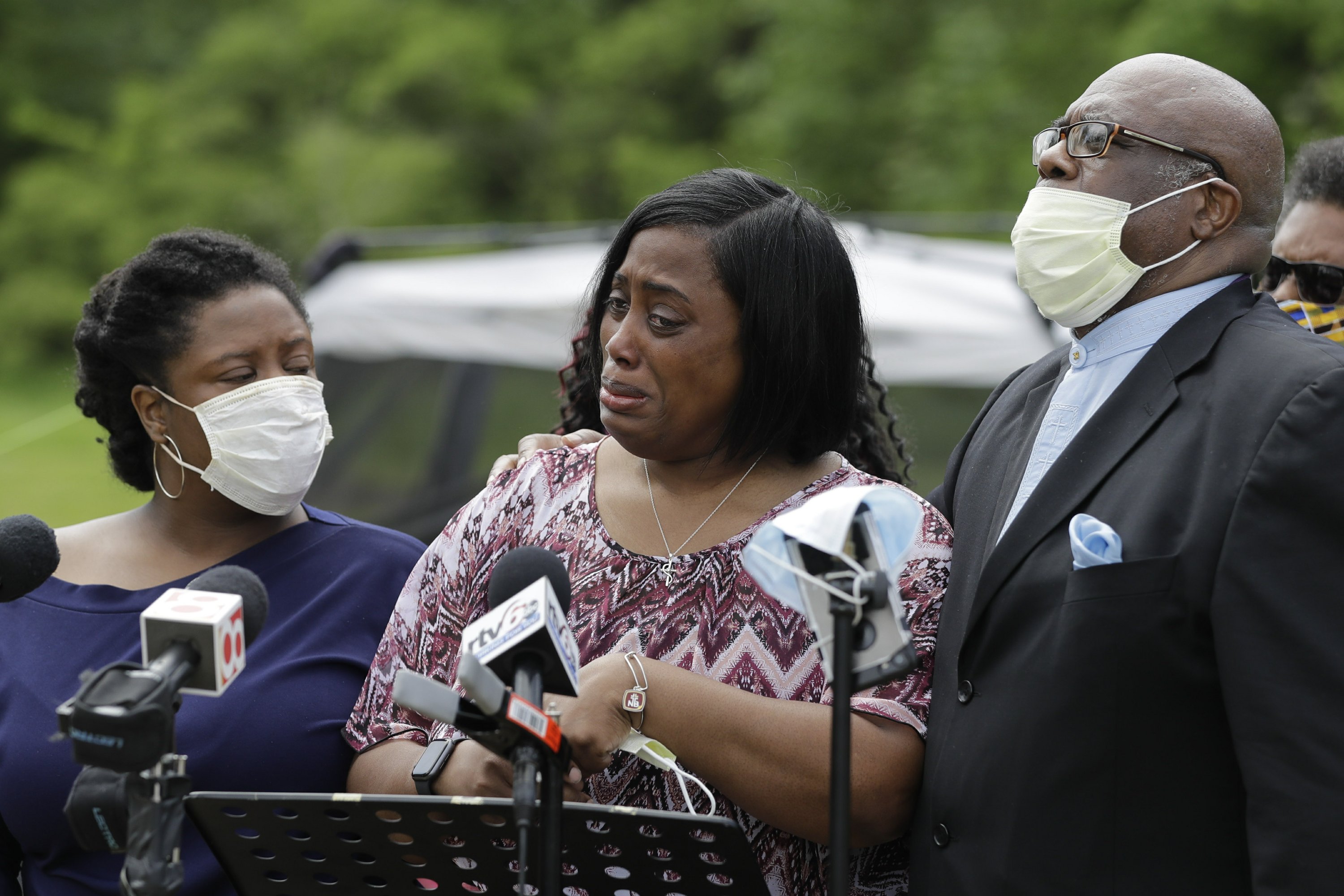 black people crying at a funeral