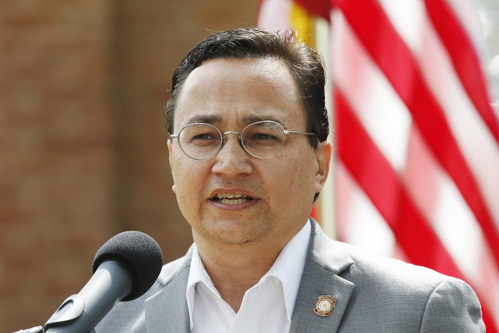 FILE - In this Aug. 22, 2019, file photo, Cherokee Nation Principal Chief Chuck Hoskin Jr., speaks during a news conference in Tahlequah, Okla. The Cherokee Nation and three opioid distributors reached a $75 million settlement to resolve opioid-related claims against the companies, the tribe and the companies announced on Tuesday, Sept. 28, 2021. (AP Photo/Sue Ogrocki, File)