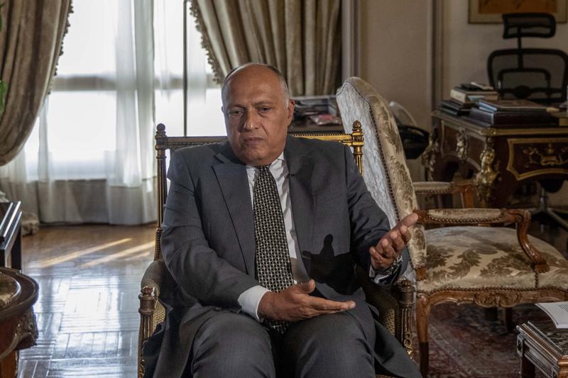 FILE - In this June 21, 2020, file photo, Egypt's Foreign Minister Sameh Shukry speaks during an interview with The Associated Press at his office in Cairo, Egypt. Shukry said Wednesday, July 7, 2021, he will urge the U.N. Security Council to require Egypt, Sudan and Ethiopia to negotiate a binding agreement within six months on the contentious issue of water availability from the dam that the Ethiopians are building on the main tributary of the Nile River. (AP Photo/Nariman El-Mofty, File)
