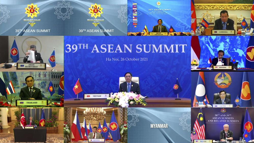 In this image released on Tuesday, Oct. 26, 2021, by Brunei ASEAN Summit in Bandar Seri Begawan, Brunei, Vietnam's Prime Minister Pham Minh Chinh, center, speaks in the virtual meeting of Association of Southeast Asian Nations (ASEAN) summit with the leaders member​ states. Southeast Asian leaders began their annual summit without Myanmar on Tuesday amid a diplomatic standoff over the exclusion of the leader of the military-ruled nation from the group's meetings. An empty box of Myanmar is seen at bottom second from right. (Brunei ASEAN Summit via AP)