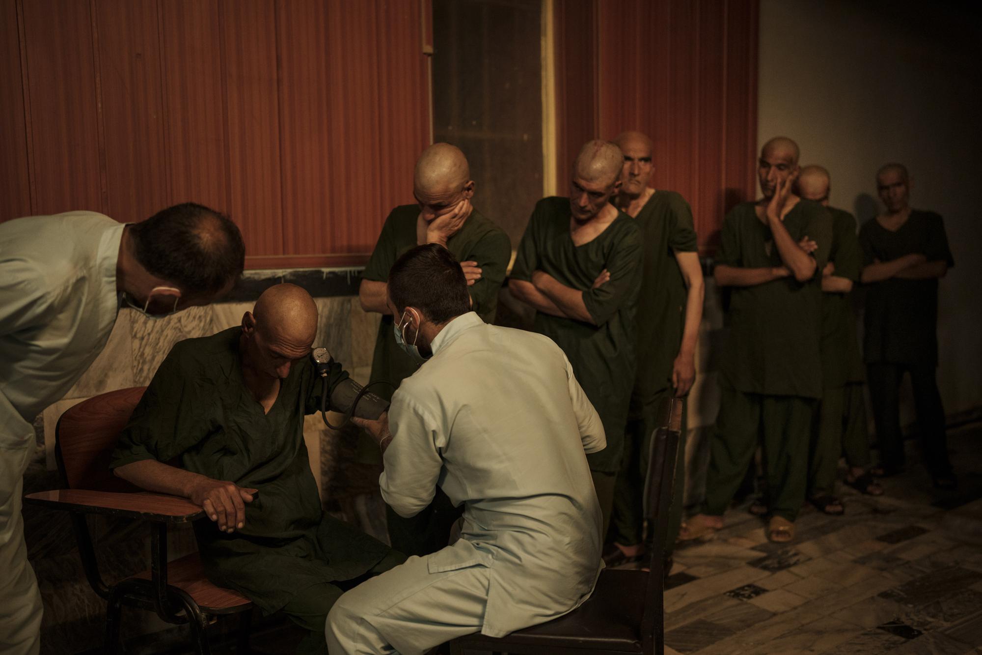 Taliban invokes Islam to weed out drugs from Afghanistan war begins with shaved heads for addicts
