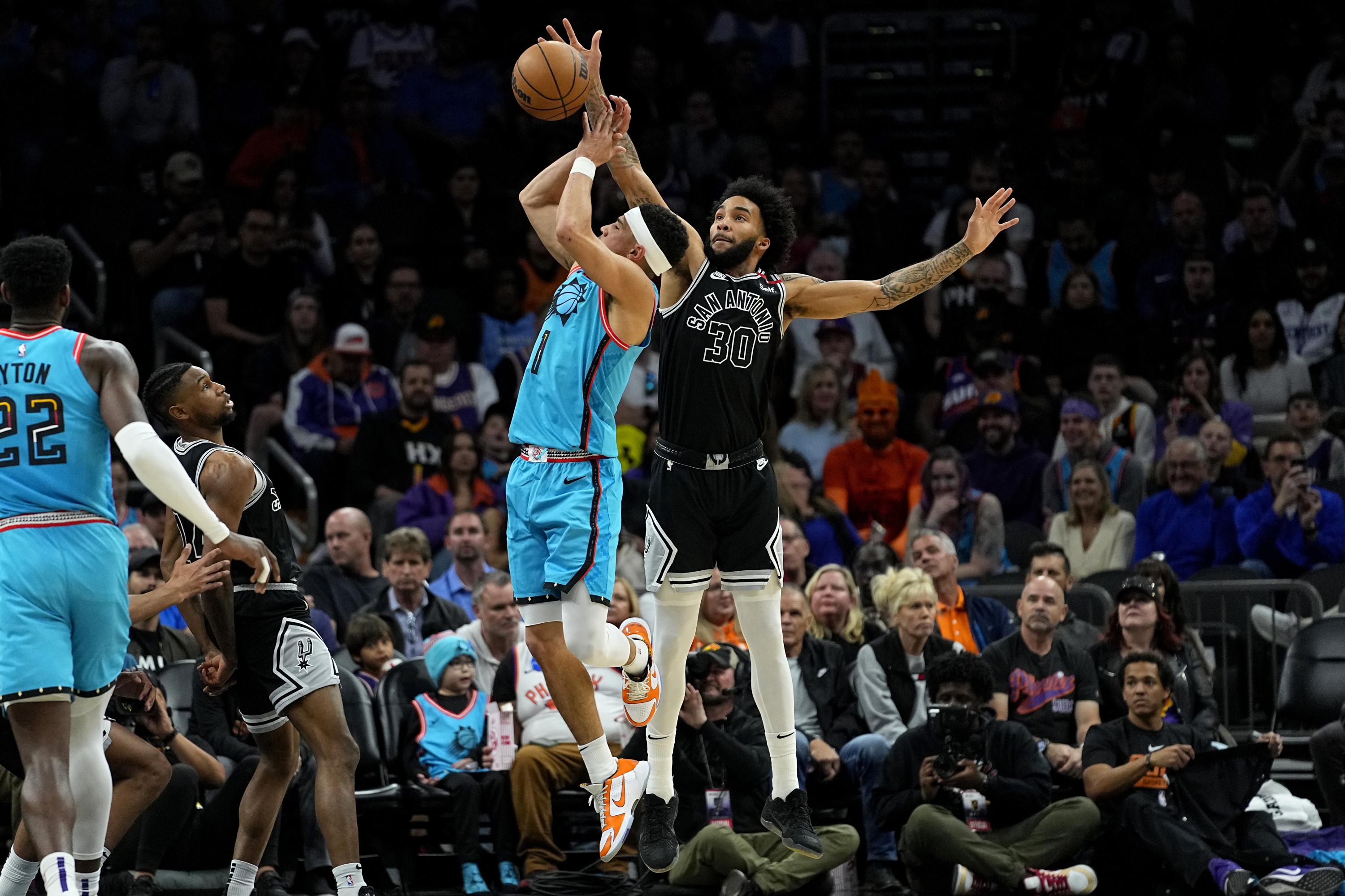 Devin Booker scores 23 in return, Suns roll past Heat to clinch playoff  spot