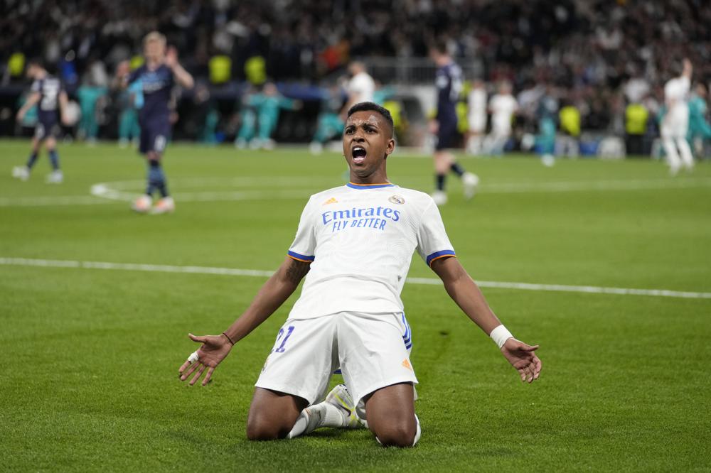 Real Madrid's Rodrygo celebrates his side's second goal during the Champions League semi final, second leg, soccer match between Real Madrid and Manchester City at the Santiago Bernabeu stadium in Madrid, Spain, Wednesday, May 4, 2022. (AP Photo/Bernat Armangue)