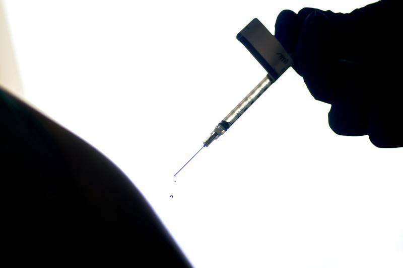 FILE - In this Dec. 15, 2020, file photo, a droplet falls from a syringe after a health care worker was injected with the Pfizer-BioNTech COVID-19 vaccine at a hospital in Providence, R.I. Genesis Healthcare, the nation’s largest nursing home operator which has 70,000 employees at nearly 400 nursing homes and senior communities, told its workers this week they will have to get COVID-19 vaccinations to keep their jobs — a possible shift in an industry that has largely rejected compulsory measures for fear of triggering an employee exodus that could worsen already dangerous staffing shortages. (AP Photo/David Goldman, File)
