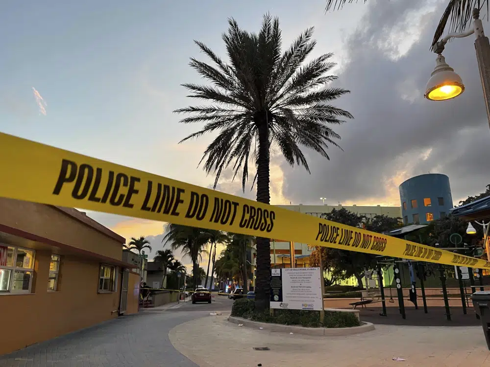 Police cordon off an area as they respond to a shooting near the Hollywood Beach Broadwalk in Hollywood, Fla., Monday evening, May 29, 2023. (Mike Stocker/South Florida Sun-Sentinel via AP)