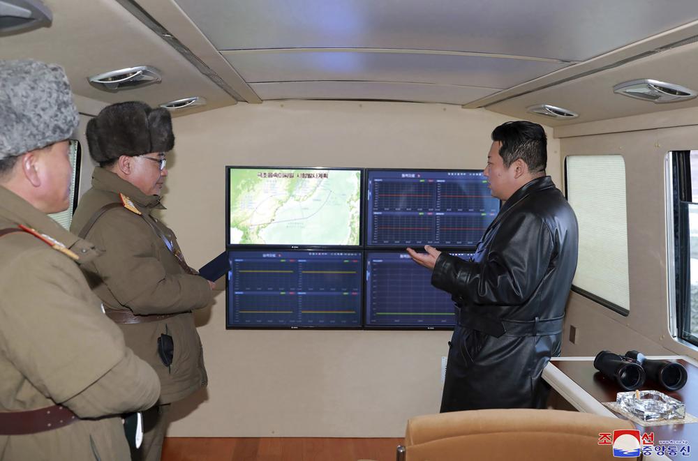 This photo provided by the North Korean government shows North Korean leader Kim Jong Un, right, looks at the monitors as a test launch of a missile on Jan. 11, 2022 in North Korea. Independent journalists were not given access to cover the event depicted in this image distributed by the North Korean government. The content of this image is as provided and cannot be independently verified. Korean language watermark on image as provided by source reads: "KCNA" which is the abbreviation for Korean Central News Agency. (Korean Central News Agency/Korea News Service via AP)