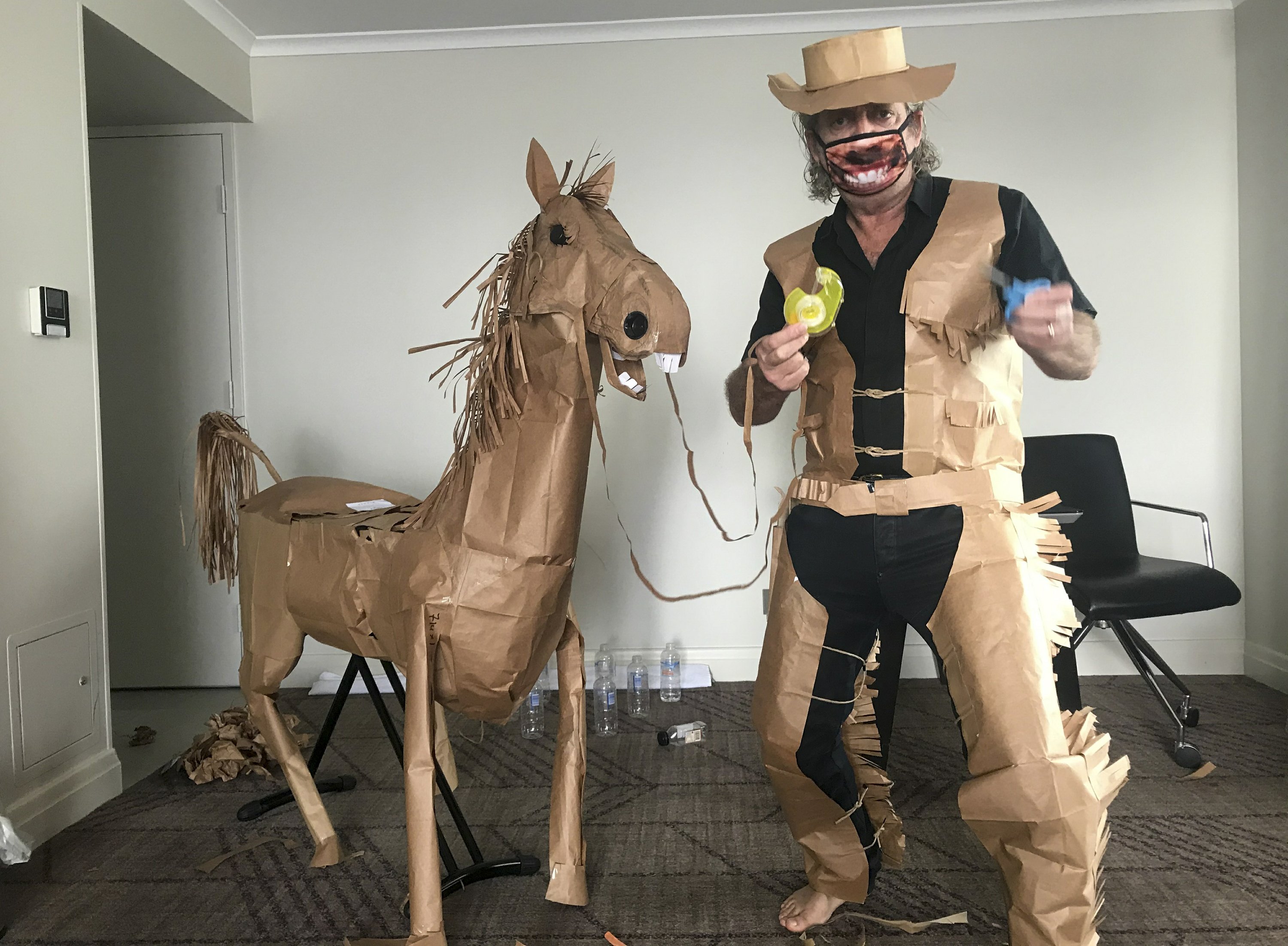 A paper cowboy drives out his quarantine at the Australian hotel