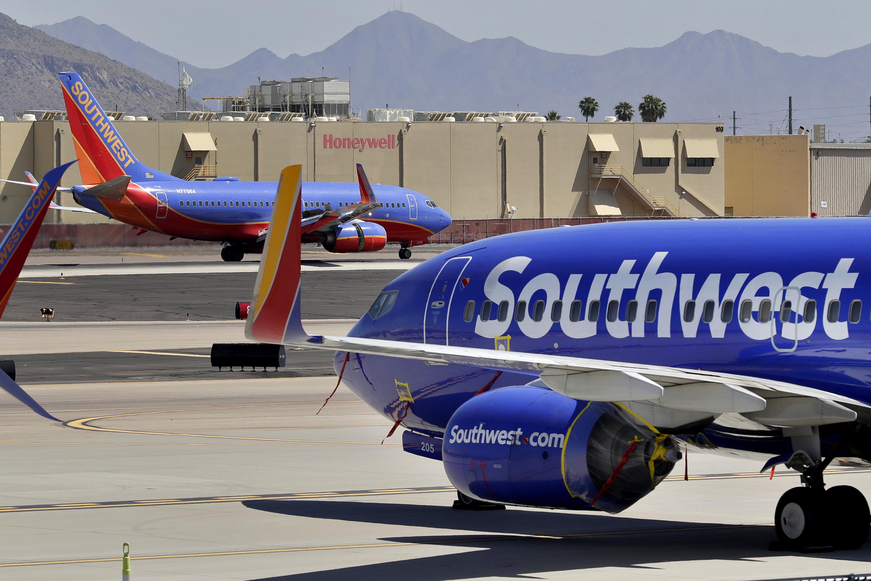 Southwest posts record revenue but warns of rising costs AP News