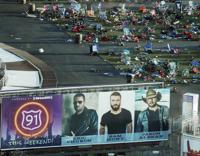 FILE - Personal belongings and debris litter the Route 91 Harvest festival grounds across the street from the Mandalay Bay resort and casino in Las Vegas on Oct. 3, 2017, after a mass shooting Oct. 1. A new documentary, “11 Minutes,” is an inside account of the 2017 massacre at a country music concert in Las Vegas. More than three hours long, the four-part documentary debuts on the Paramount+ streaming service Tuesday. (AP Photo/Marcio Jose Sanchez, File)