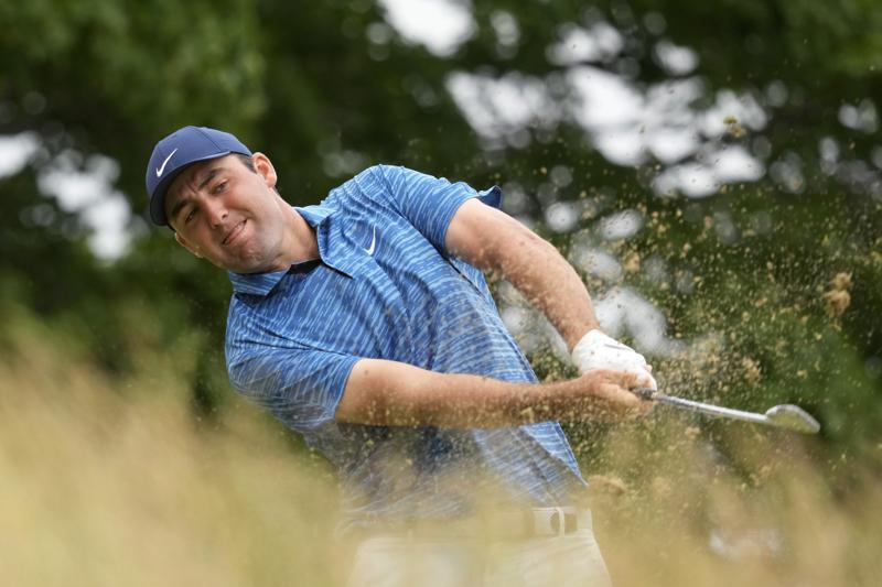 Scottie Scheffler hits on the sixth hole during the second round of the U.S. Open golf tournament at The Country Club, Friday, June 17, 2022, in Brookline, Mass. (AP Photo/Charlie Riedel)