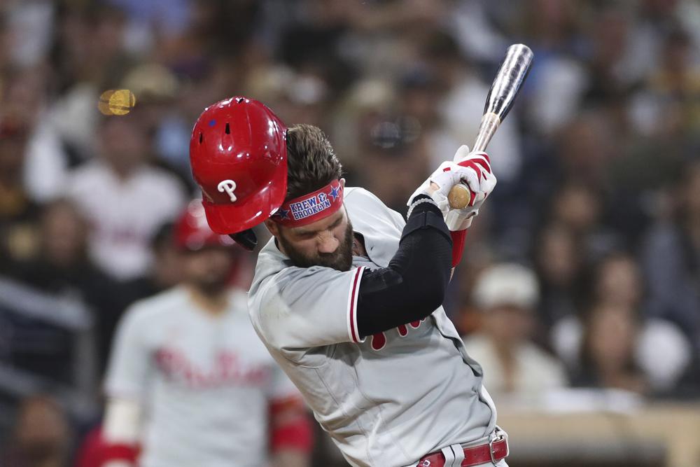 Philadelphia Phillies' Bryce Harper reacts after being hit by a pitch from San Diego Padres' Blake Snell during the fourth inning of a baseball game Saturday, June 25, 2022, in San Diego. (AP Photo/Derrick Tuskan)