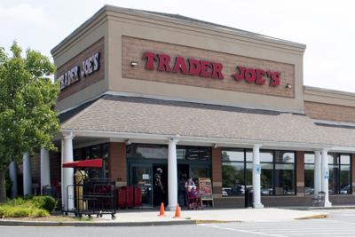 A shopper pushes a cart from the Trader Joe's supermarket on Thursday July 28, 2022, in Hadley, Mass. Employees at the store on Thursday became the latest workers at a major company to approve a labor union. The store in Hadley is the first Trader Joe's with an employees union. (Carol Lollis/The Daily Hampshire Gazette via AP)