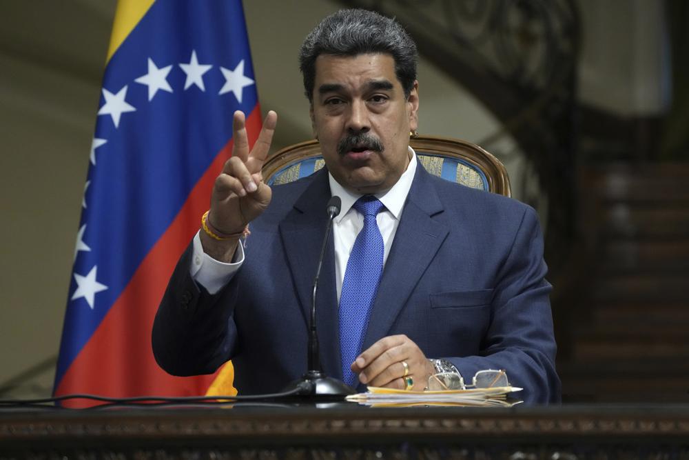 Venezuela's President Nicolas Maduro gestures as he speaks in a joint news briefing with his Iranian counterpart Ebrahim Raisi at the Saadabad Palace in Tehran, Iran, Saturday, June 11, 2022. (AP Photo/Vahid Salemi)