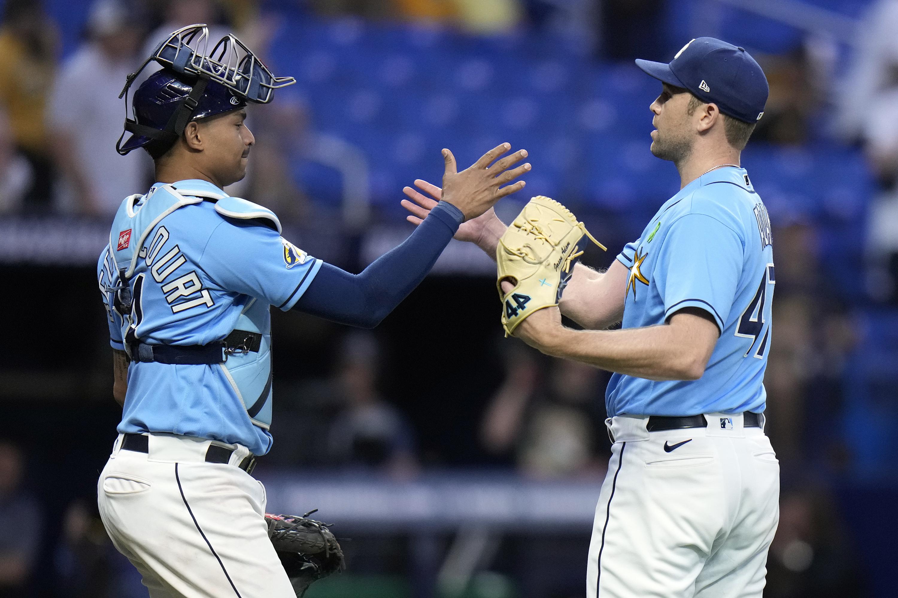 Tampa Bay Rays pitcher Jason Adam, left, and catcher Christian