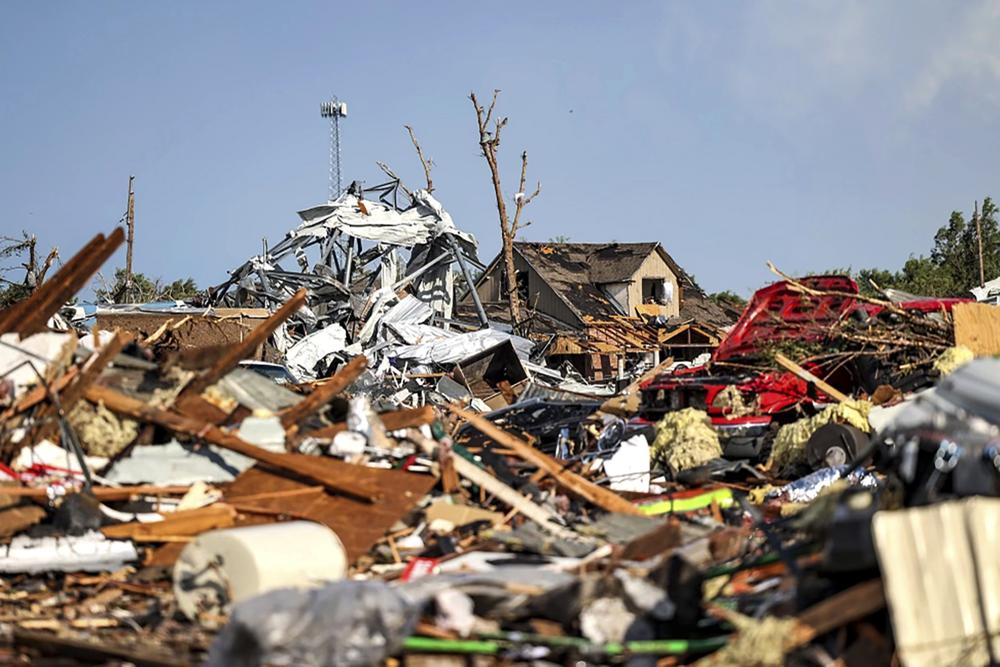 Debris covers a residential area in Perryton, Texas, Thursday, June 15, 2023, after a tornado struck the town. (AP Photo/David Erickson)