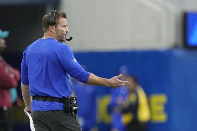 Rams' McVay takes accidental helmet to jaw on sideline | AP News Rams' McVay takes accidental helmet to jaw on sideline | AP News
