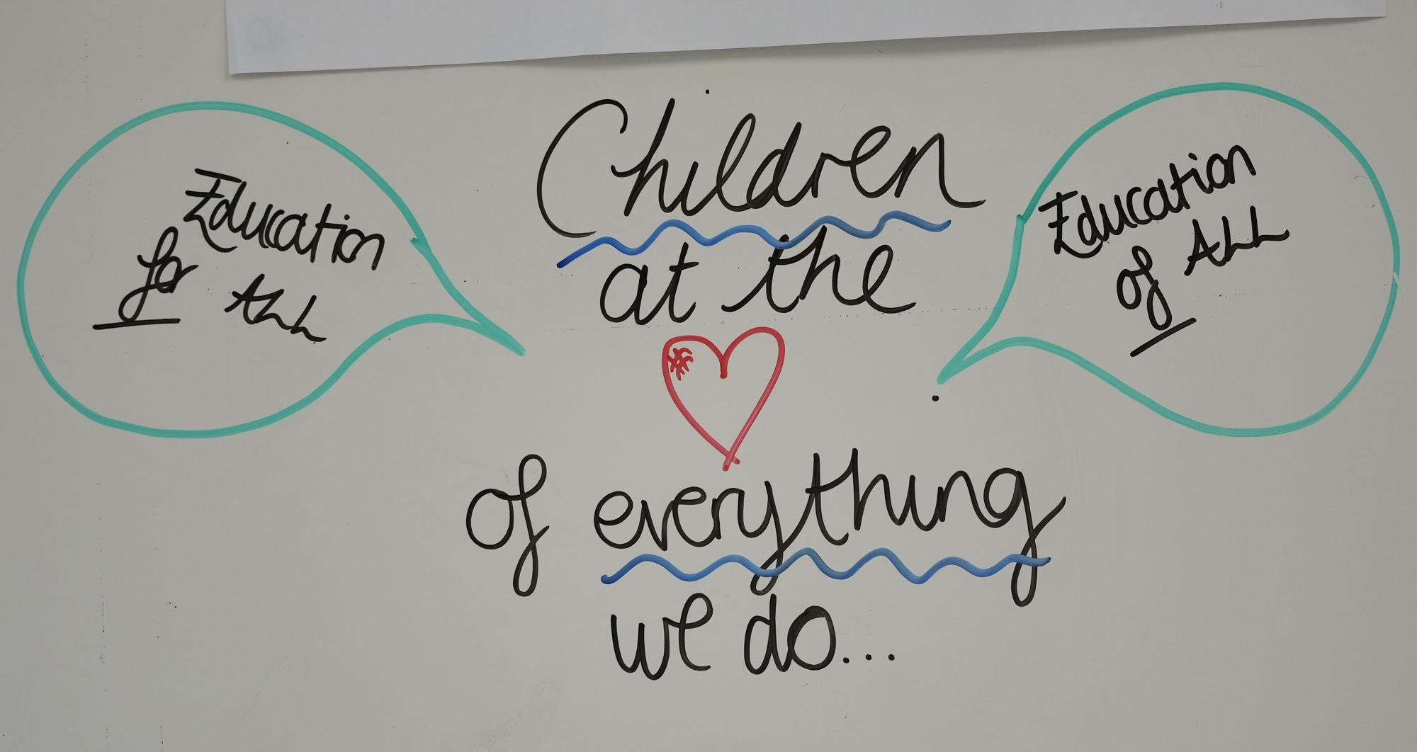 A staff notice written on a notice board in the teachers common room at the Holy Family Catholic Primary School in Greenwich, London, Thursday, May 20, 2021. Holy Family, like schools across Britain, is racing to offset the disruption caused by COVID-19, which has hit kids from low-income and ethnic minority families hardest. (AP Photo/Alastair Grant)