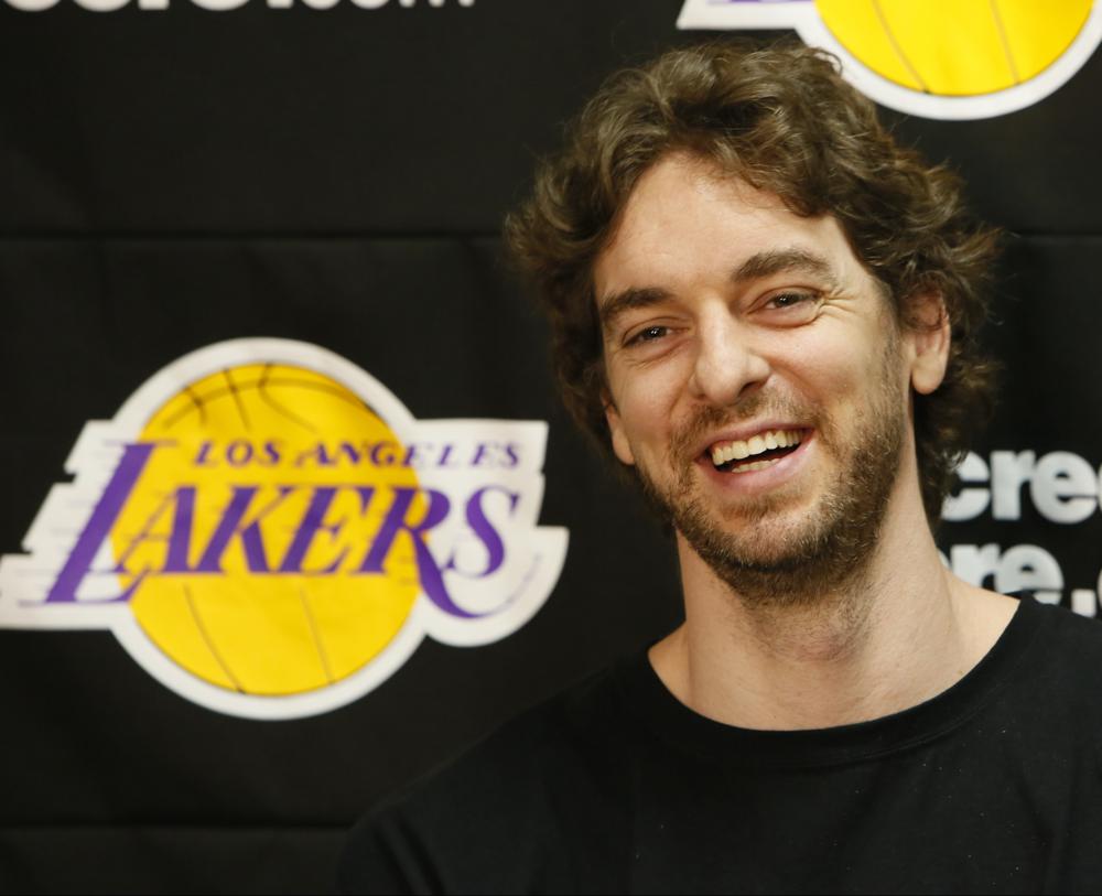 FILE - In this April 30, 2013 file photo, Los Angeles Lakers power forward Pau Gasol smiles while talking to reporters during an NBA basketball news conference in El Segundo, Calif. Pau Gasol announced his retirement from basketball on Tuesday,  Oct. 5, 2021, ending a career that lasted more than two decades and earned him two NBA titles and a world championship gold with Spain's national team. (AP Photo/Damian Dovarganes, File)
