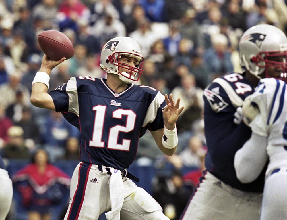 FILE - In this Sept. 30, 2001 file photo, New England Patriots quarterback Tom Brady (12) passes during Brady's first start of an NFL football game against the Indianapolis Colts in Foxborough, Mass. Brady, who won a record seven Super Bowls for New England and Tampa, has announced his retirement, Wednesday, Feb. 1, 2023. (AP Photo/Winslow Townson, File)