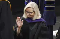 Former U.S. Rep. Liz Cheney, R-Wyo., waves before delivering the commencement address at Colorado College, Sunday, May 28, 2023, in Colorado Springs, Colo. (AP Photo/Jack Dempsey)
