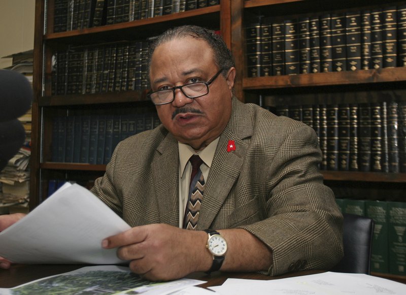 FILE - In this June 16, 2010, file photo, Rep. Alvin Holmes, D-Montgomery talks to reporters at his Montgomery, Ala., office. Former Rep. Holmes has died at the age of 81. Holmes had been the longest-serving member of the Alabama House of Representatives before his defeat in 2018. State House of Representatives spokesman Clay Redden confirmed Holmes’ death Saturday, Nov. 21, 2020. (AP Photo/Jamie Martin, File)