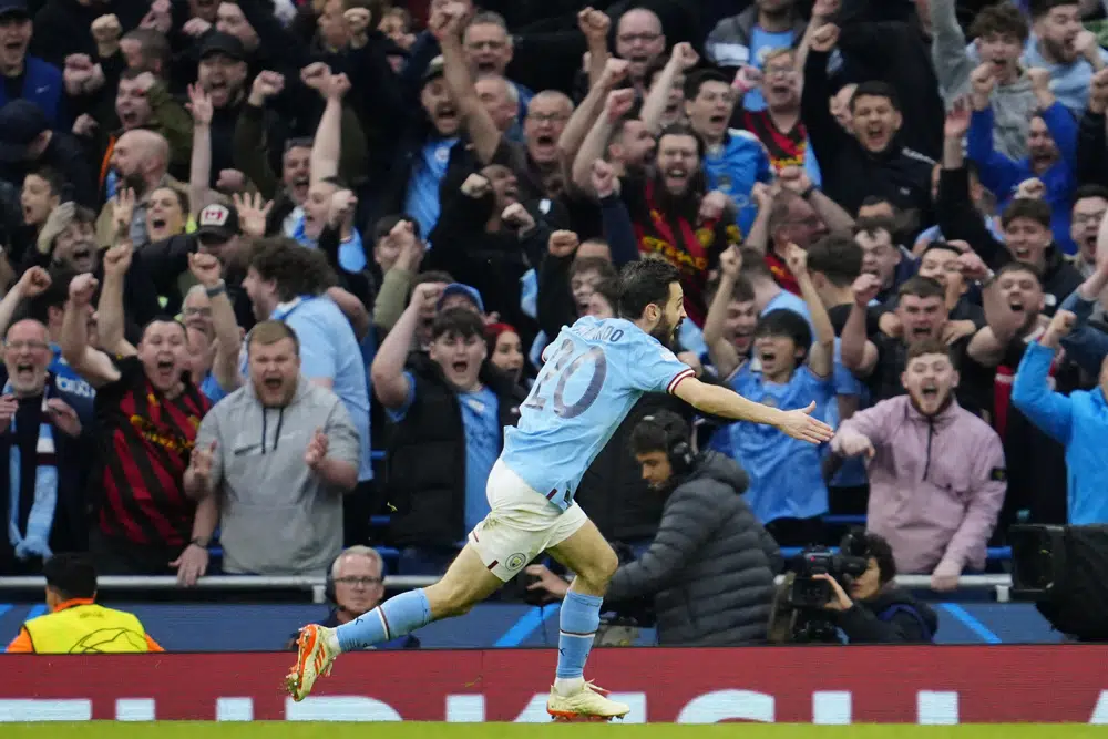 Manchester City's Bernardo Silva celebrates after scoring the opening goal during the Champions League semifinal second leg soccer match between Manchester City and Real Madrid at Etihad stadium in Manchester, England, Wednesday, May 17, 2023. (AP Photo/Jon Super)
