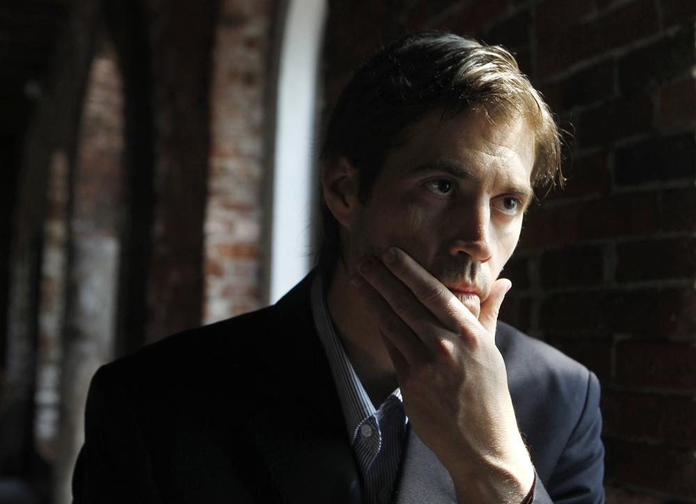 FILE - Journalist James Foley responds to questions during an interview in Boston on Friday, May 27, 2011. The family of slain American journalist Steven Sotloff filed a federal lawsuit Friday, May 13, 2022, accusing prominent Qatari institutions of wiring $800,000 to an Islamic State “judge” who ordered the murder of Sotloff and another American journalist, James Foley. (AP Photo/Steven Senne, File)