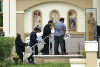 Pallbearers carry the casket of Marcus Guara's daughters before a funeral service for the family at St. Joseph Catholic Church, Tuesday, July 6, 2021, in Miami Beach, Fla. Guara, his wife Anaely, and daughters Lucia and Emma, died in the collapse of the Champlain Towers South condominium building in nearby Surfside. (AP Photo/Lynne Sladky)
