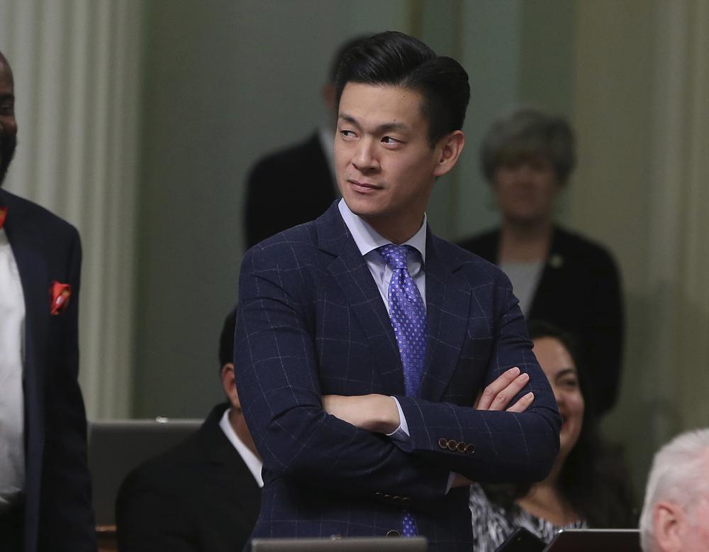 FILE - In this Aug. 31, 2018, file photo, Assemblyman Evan Low, D-Campbell, watches the debate over a bill during the Assembly session in Sacramento, Calif. California is the first state to require large department stores to display products like toys and toothbrushes in gender neutral ways. Gov. Gavin Newsom signed the law on Saturday, Oct. 9, 2021. This is the third time Democrats in the state Legislature have tried to pass this law, with similar bills failing in 2019 and 2020. Low authored the bill this year. He said he was inspired by the 10-year-old girl daughter of one of his staffers, who asked her mom why certain items in the store were
