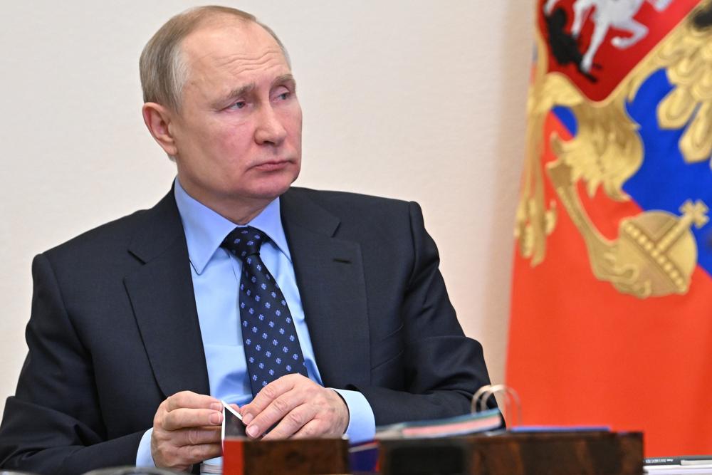 Russian President Vladimir Putin attends a meeting of judges of general jurisdiction and arbitration courts of the Russian Federation via videoconference at the Novo-Ogaryovo residence outside Moscow, Russia, Wednesday, Feb. 9, 2022. (Alexei Nikolsky, Sputnik, Kremlin Pool Photo via AP)