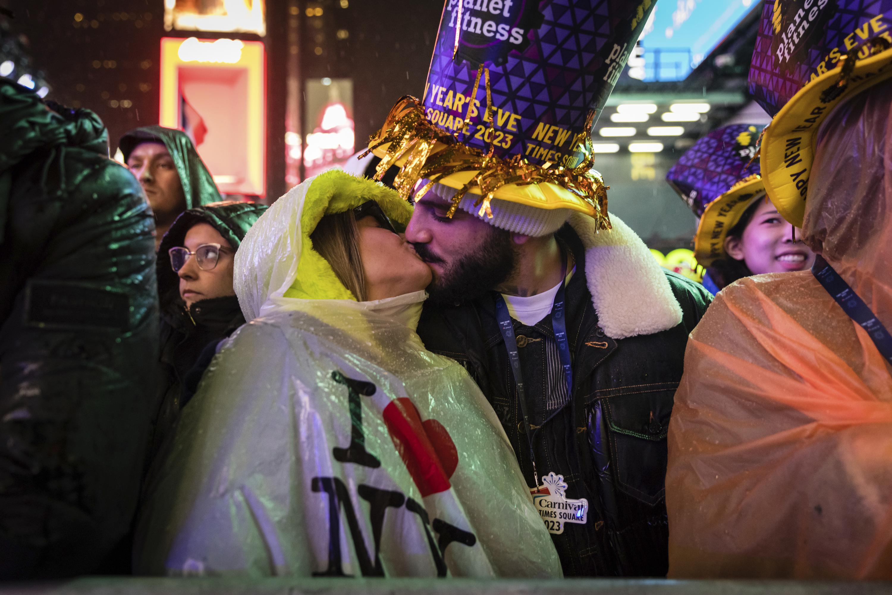 Times Square on X: Revelers create a sea of purple & yellow as